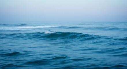 Fototapeta premium Ocean waves at dawn, soft, hazy light