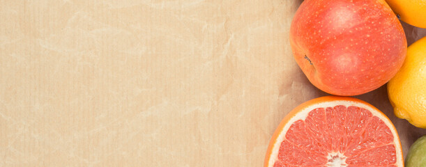 Ripe fruits on old paper. Healthy lifestyle. Fruits as source minerals and vitamins. Place for text