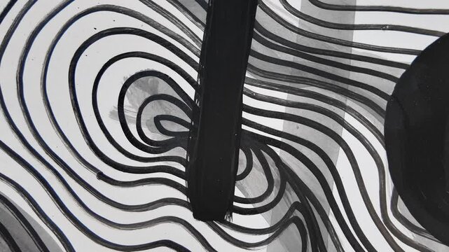 A black and white drawing of a wave with a circle in the middle