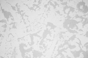 Textured gray wall featuring intricate patterns and soft tonal variations