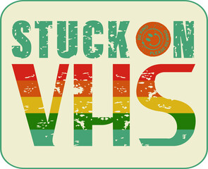 Retro design is showing STUCK ON VHS with rainbow stripes rewind-sticker on clear layer, copy space
