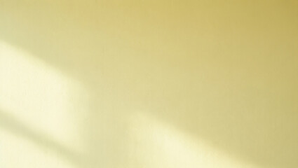 Soft Yellow Wall with Subtle Texture and Natural Light Shadow