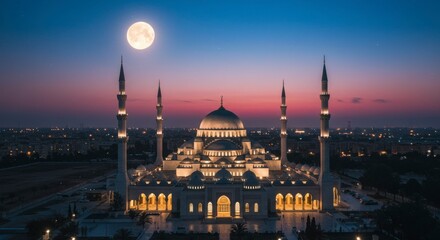 Fototapeta premium Majestic mosque at dawn, lit by moon and cityscape