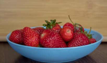 Bowl fill with strawberries.