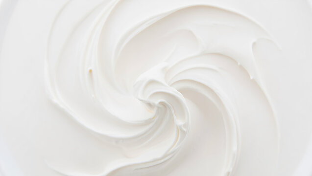 Swirl of Smooth White Creamy Frosting or Yogurt Close Up Texture