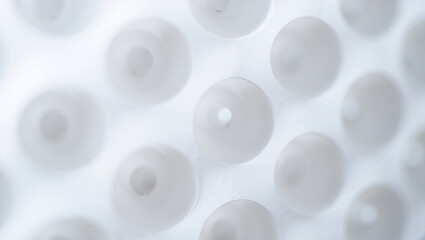 Abstract White Spheres with Central Holes Floating in a Dreamy Light