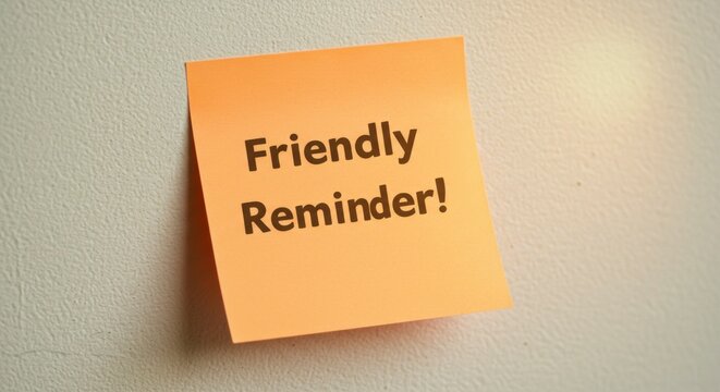 Orange sticky note on a wall, displaying a friendly reminder message
