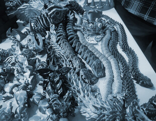 Art objects printed on a 3D printer. Various creative models created on a 3D printer from molten...