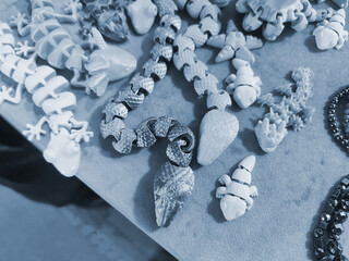 Art objects printed on a 3D printer. Various creative models created on a 3D printer from molten...