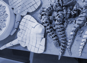 Art objects printed on a 3D printer. Various creative models created on a 3D printer from molten...