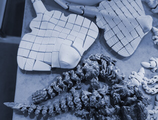 Art objects printed on a 3D printer. Various creative models created on a 3D printer from molten...