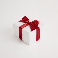 Obraz premium A beautifully wrapped gift box, tied with a festive red ribbon, presenting a sense of anticipation and joy