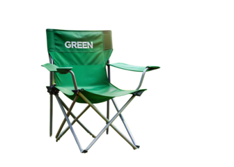 A green folding chair with the word green written on the back isolated on a black background outdoors