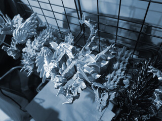 Art objects printed on a 3D printer. Various creative models created on a 3D printer from molten...