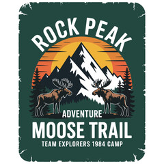 Obraz premium Retro vintage camping emblem with mountain peak, moose silhouettes, and adventure text in earthy tones