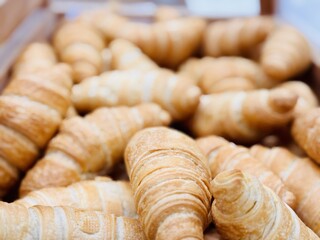 A delightful stack of warm, freshly baked, golden croissants is beautifully arranged. An enticing...