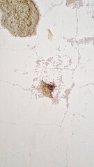 Raw plug holes in a wall