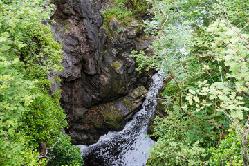 Small river flowing over granite rocks