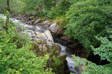 Small river flowing over granite rocks