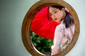 Pretty Japanese woman dressing in traditional kimono or yukata costume 