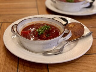 Soup vegetables red borscht on table. First course vegetable dish fresh delicious gourmet food background on the table rustic food vegetarian and vegan food. Close-up