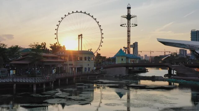 Exploring the Shun Tak Ferris Wheel Area at Sunset Reflecting in the Water, Located in br