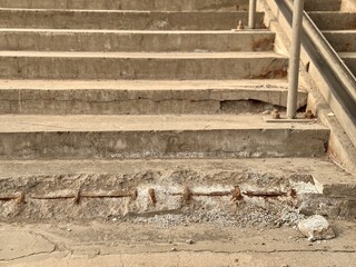 Weathered Concrete Steps Found in an Urban Environment and City Life Above and Below. An image...