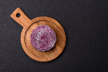 Chinese mooncake is an Asian sweet dessert. Asian mooncake as a background for your design