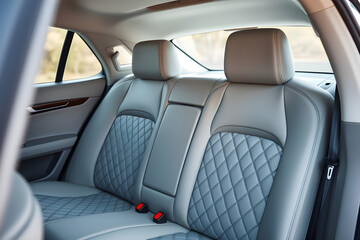 elegant, luxurious car interior plush leather seals ,diamond pattern stitching ,wood grain trim, ambient lighting premium, sophisticated high-end