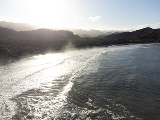 Deserted Barra do Sahy beach at dawn with small waves