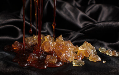 Melted candy glass art on elegant black velvet