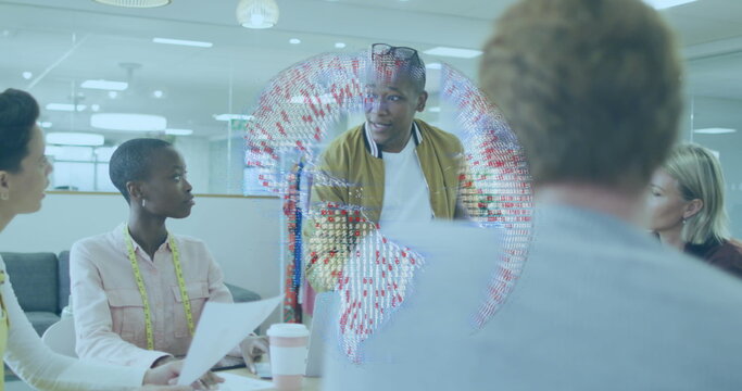 Presenting businessman gesturing at digital globe hologram in office meeting, with laptops - Powered by Adobe