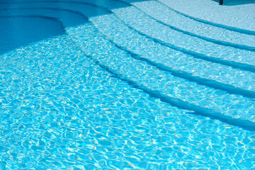 Empty swimming pool with sunbed and white modren resort hotel for vacation leisure and white...