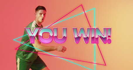 Reacting green-shirt athlete celebrating win in studio, with neon triangles, YOU WIN!, copy space