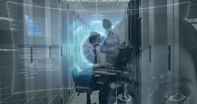 IT professionals typing and examining network cables in data center aisle, with network graphics