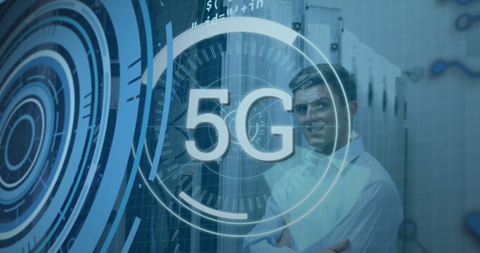 Standing telecom engineer crossing arms in data center with racks, cables and 5G overlay copy space