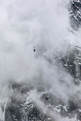 Cable car of Aiguille du Midi against the stormy clouds, Chamonix, Mont Blanc, France, Europe