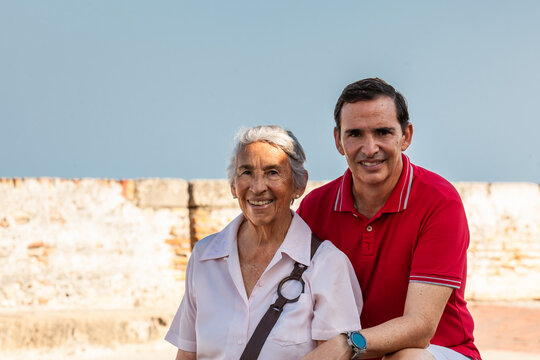 Adult son and his senior mother in Cartagena de Indias. Real family. Family love. Family travel concept.