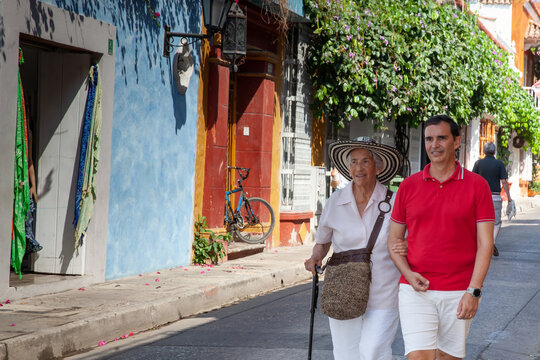 Adult son and his senior mother in Cartagena de Indias. Real family. Family love. Family travel concept.