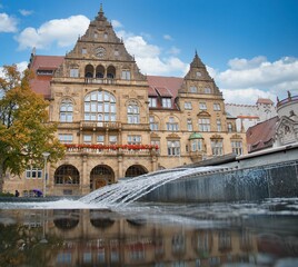 Naklejka premium Old Bielefeld town hall from below with the fountain in the foreground on a nice day