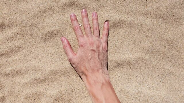 Background with hand movement on sand
