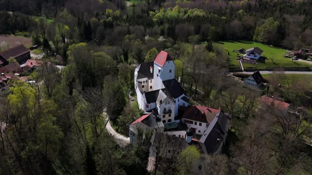 Aerial view of Schloss Elkofen, historic Bavarian castle nestled in green meadows near Grafing, Upper Bavaria. Scenic medieval landmark, blending nature, heritage, timeless architecture. Burg Elkofen