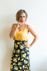 Pensive woman touching chin, expressing curiosity and contemplation