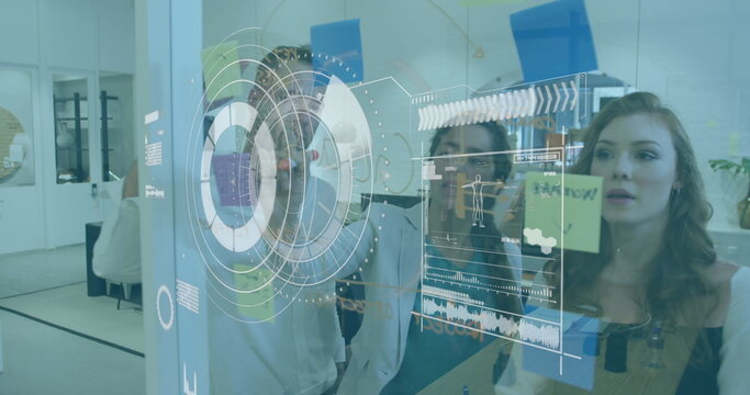 Image of scope scanning over businessman using laptop