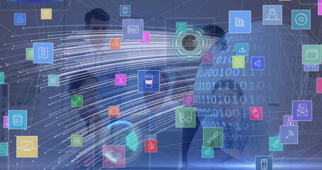 Collaborating team presenting holographic data in office with floating icons, globe and tablet