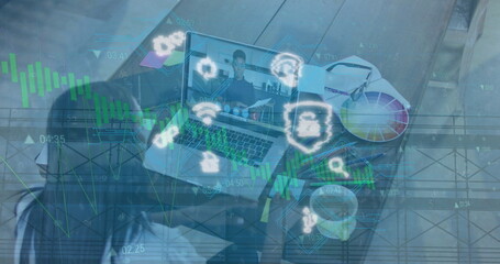 Displaying laptop showing call with colleague holding documents in home office with color palette