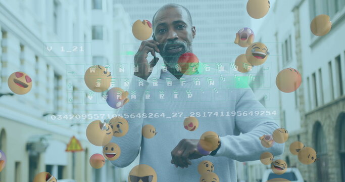 Talking man holding smartphone and checking watch on street, with floating emojis and code overlay