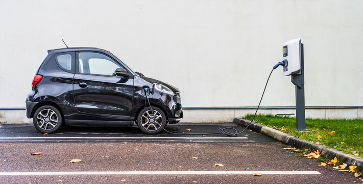 Gothenburg, Sweden - October 13 2024: Black 2022 Zhidou electric micro car parked and charging.