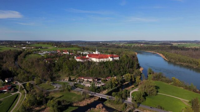 Aerial view Luftaufnahme of Attel Monastery and St. Michael Church on Attel Hill by Inn River, near Wasserburg am Inn, Bavaria. Historic Benedictine site, scenic spring landscape, rural Germany charm