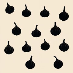A large number of black garlic bulbs arranged in a pattern on a white background